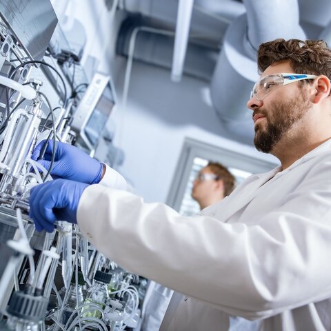 Scientist working on bioreactor cultivation setup for optimizing methanol-induced protein production using VALIDOGEN’s UNLOCK PICHIA® technology.