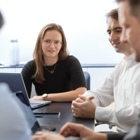 VALIDOGEN's Pichia experts sitting on a table